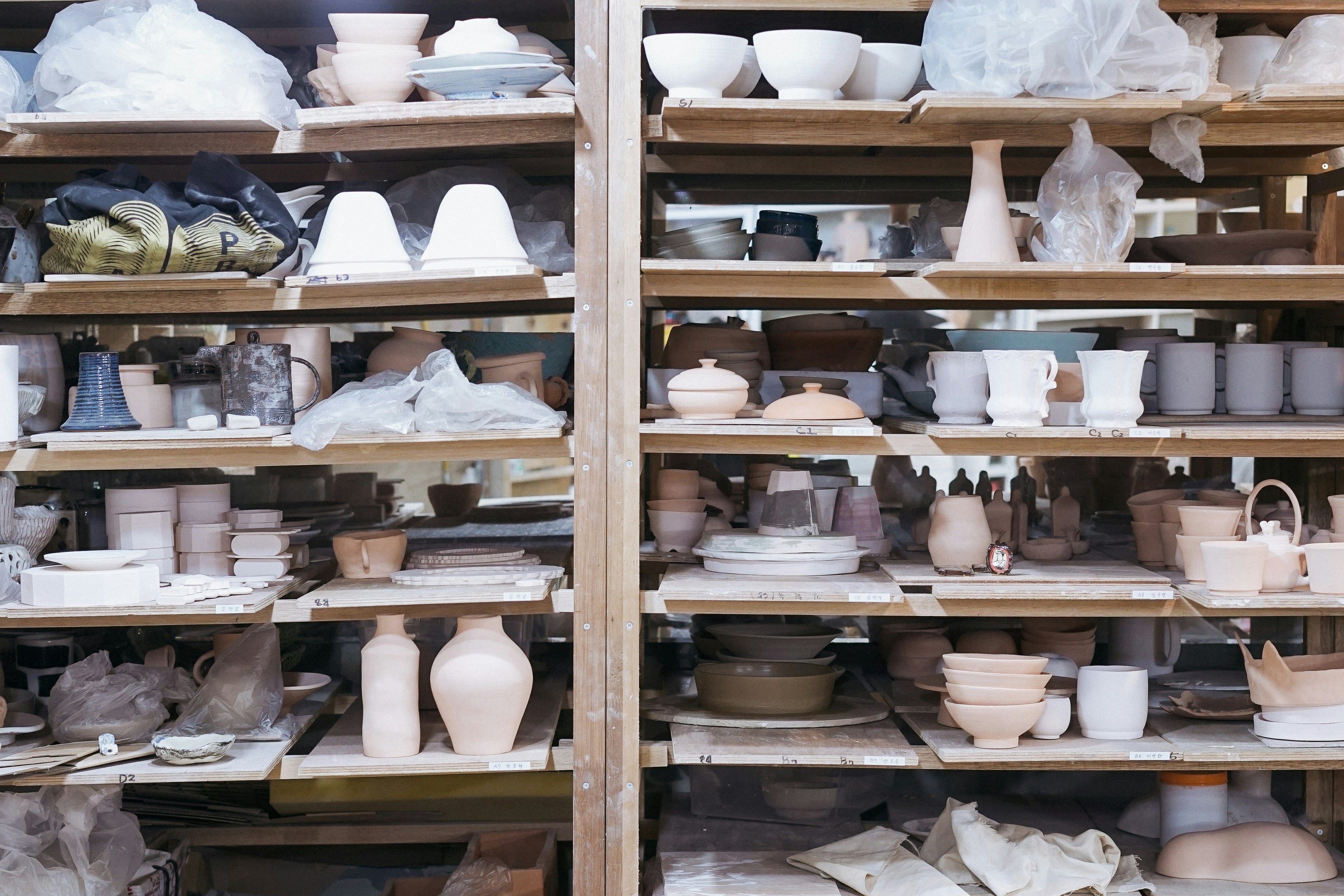 Image of shelves full of pottery and projects